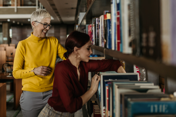 Warm library interior with bookshelves filled with books